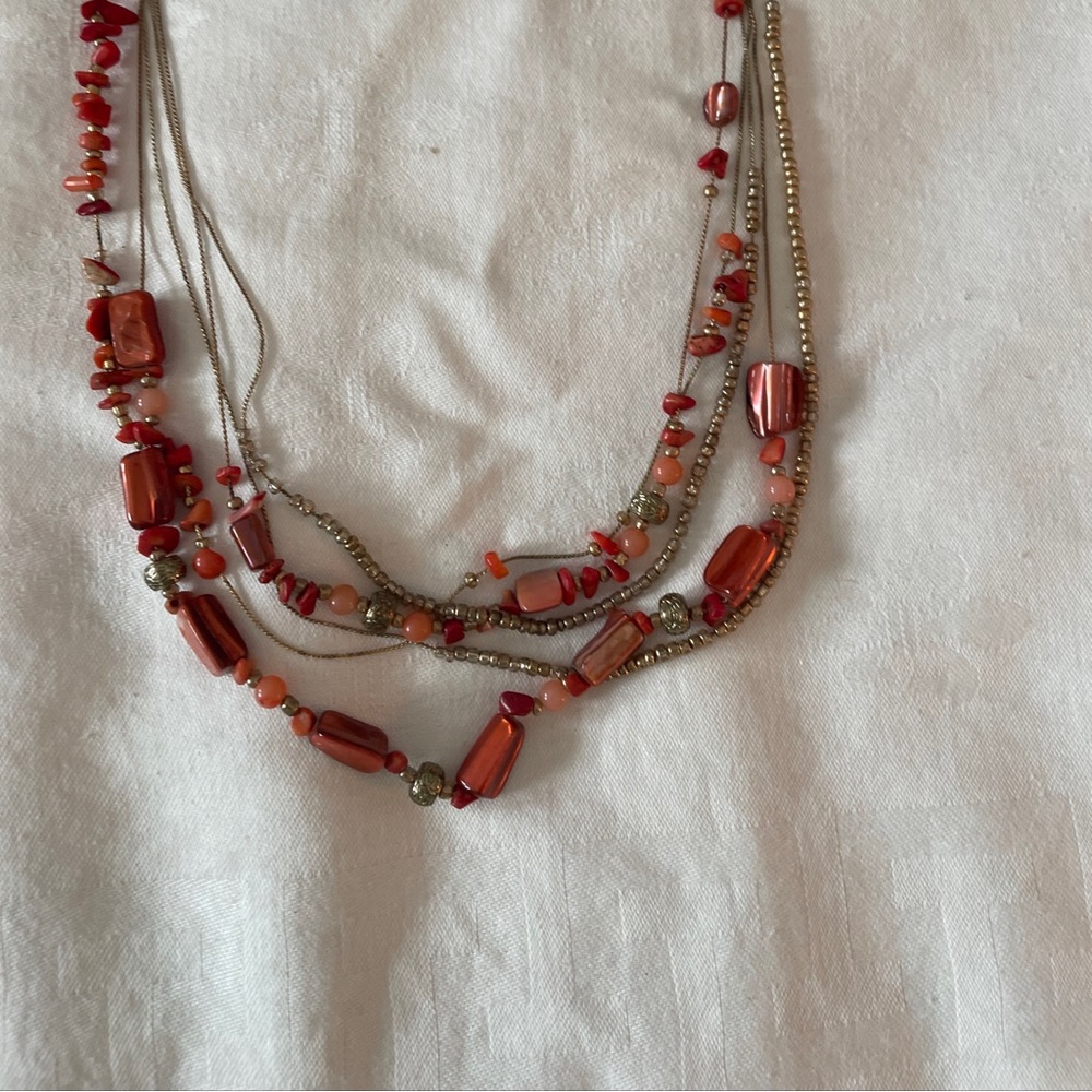 Beautiful, coral colored beaded necklace. 18 inches in length. A must have piece